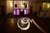 Personalized Monogram - Your name in lights!  Illuminate your reception venue with this custom-made lighting effect.  This special lighting effect can be customized to the font style of your choice, your last name, the date of your wedding, interlocking hearts, the possibilities are endless.  This versatile light can be displayed on the dance floor during cocktail hour and your first dance as husband and wife, then rotating behind your cake for a romantic glow throughout your entire reception.  At the end of your evening you will receive your customized engraved template as a keepsake!  Bring this template back to Rockin’ Ramaley when you plan your wedding anniversary party and at no additional charge the customized light will be displayed as it was on your wedding day!